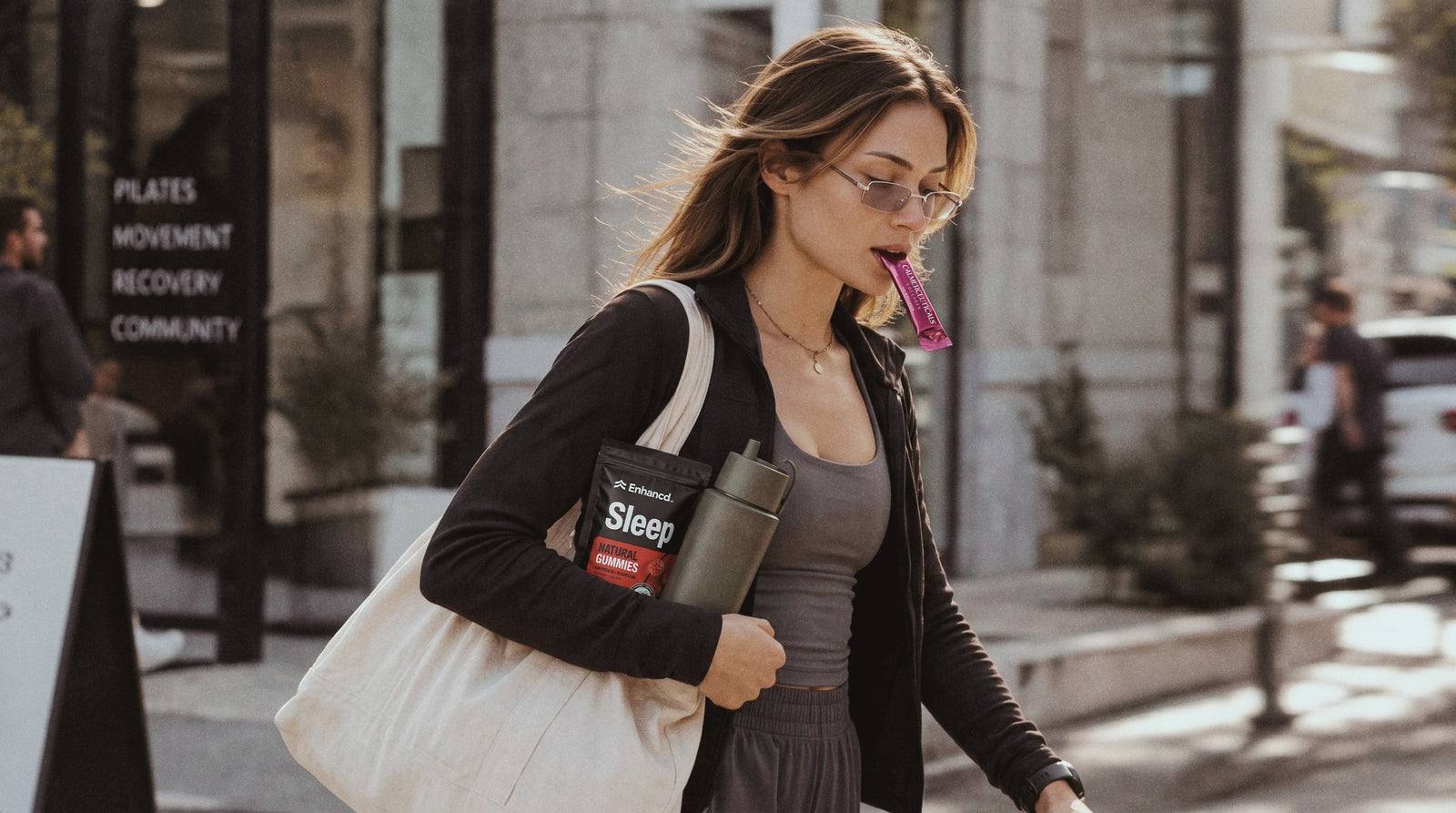 A woman carrying wellness products while walking outdoors