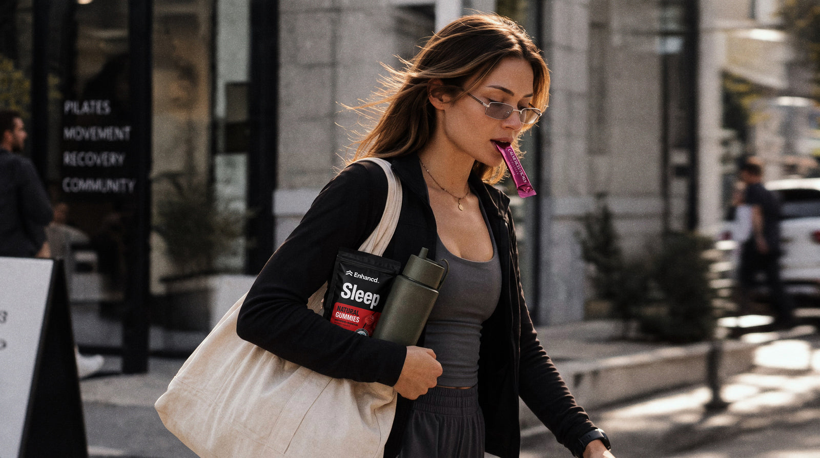 A woman carrying wellness products while walking outdoors