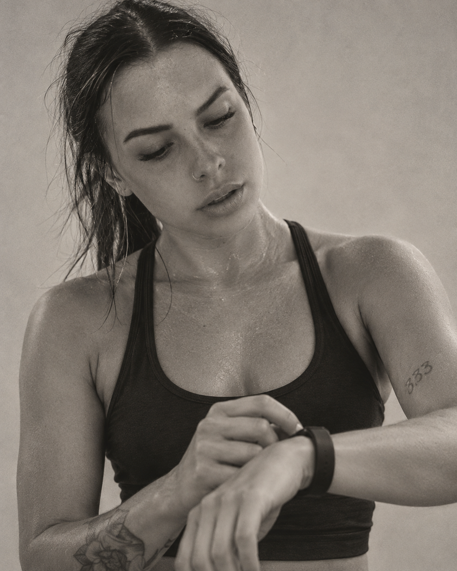 Athletic woman checking the wearable on her wrist